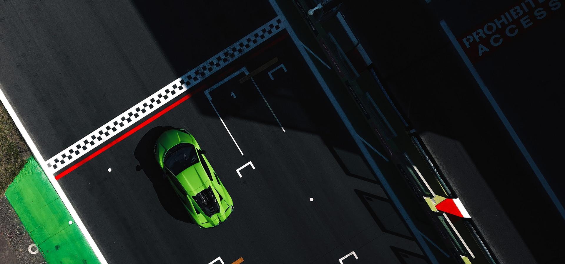Lamborghini Revuelto V12 hybrid supercar in Verde Shock green on the track